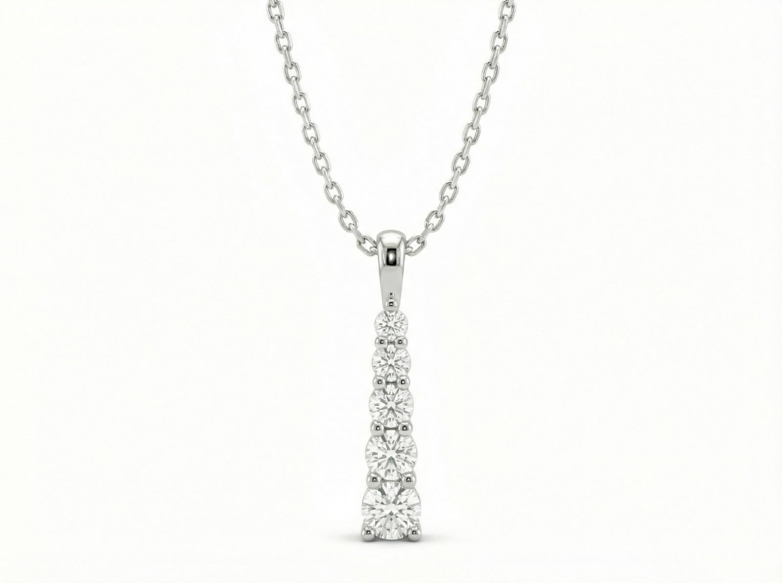 Collar Cascada Lumínica de Sejem Joyas. Dije vertical en plata 925 con 5 zirconias en tamaño degradado.
