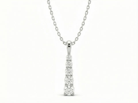 Collar Cascada Lumínica de Sejem Joyas. Dije vertical en plata 925 con 5 zirconias en tamaño degradado.